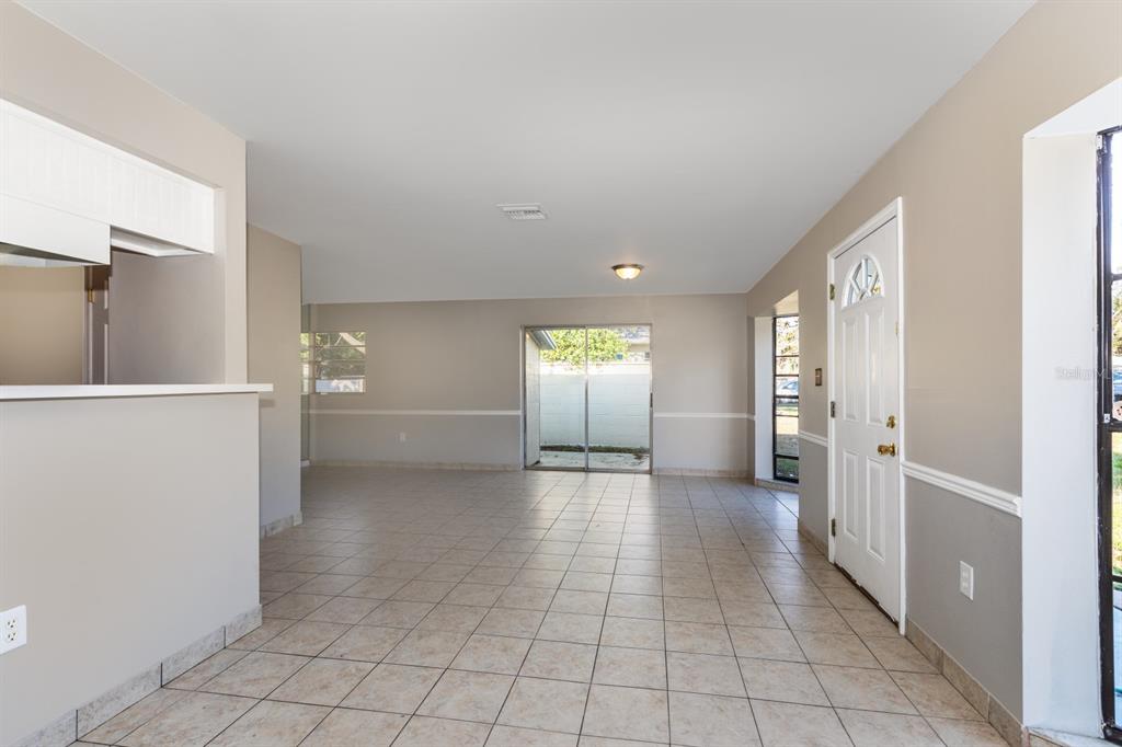 2436 Northland Road Mount Dora, FL 32757 - Photo 5 of 27 a view of a hallway with wooden shelves
