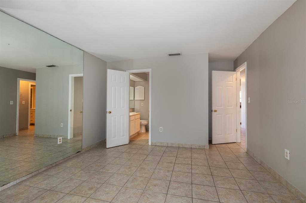 2436 Northland Road Mount Dora, FL 32757 - Photo 9 of 27 an empty room with a bathroom