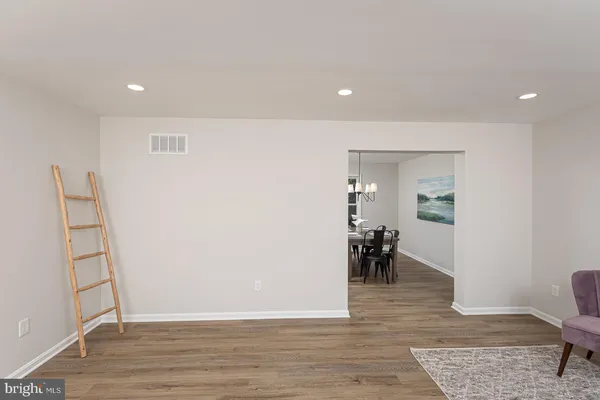 a view of a living room and dining room