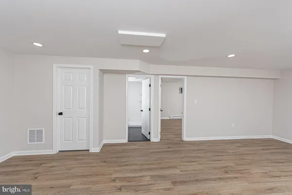 a view of wooden floor in an empty room