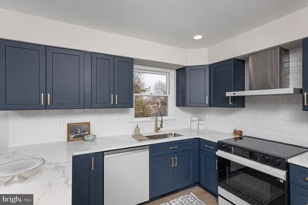 a kitchen with wooden cabinets and a sink
