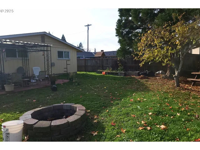 a view of a park with large trees