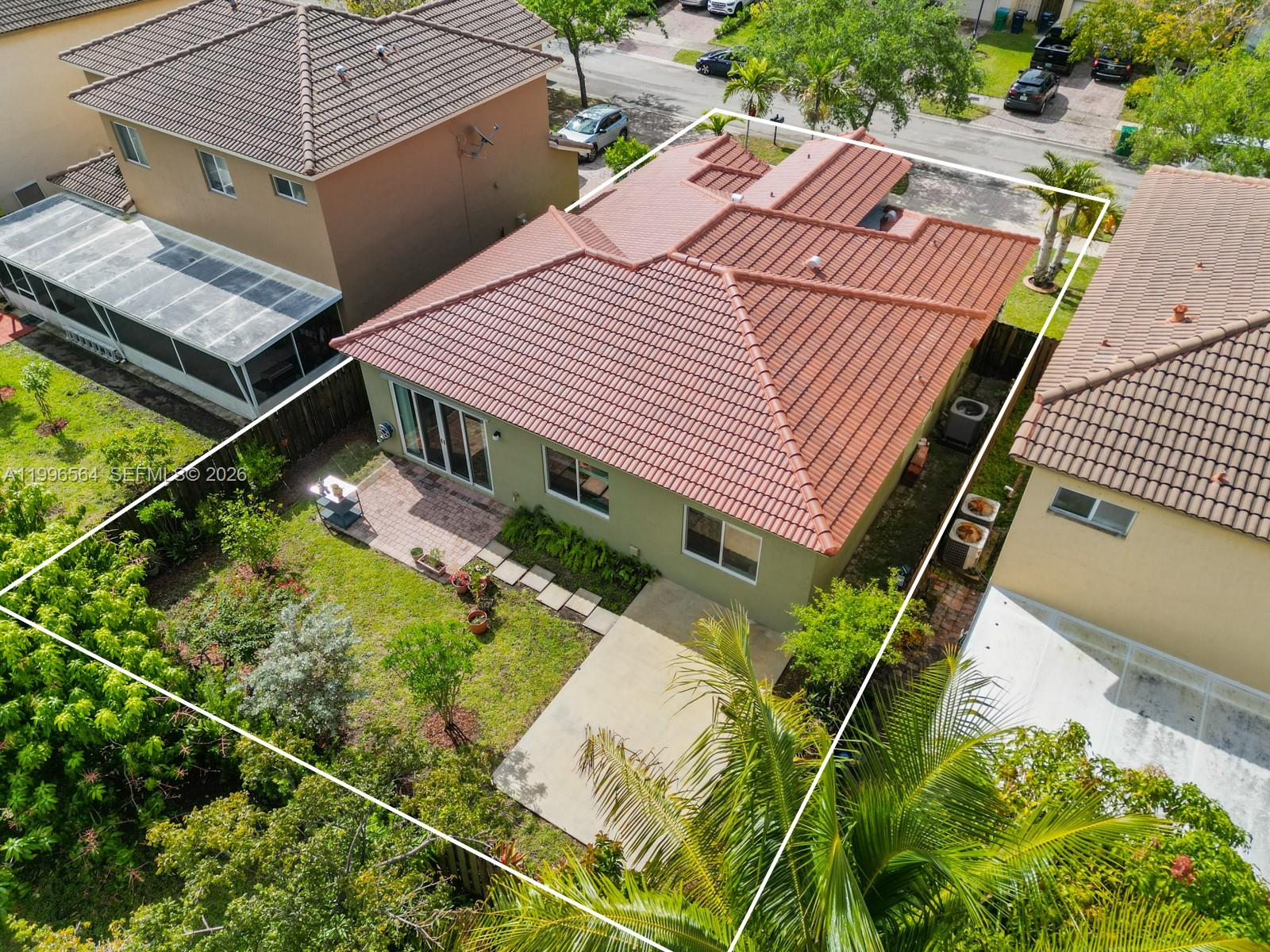 9473 Southwest 227th Terrace Cutler Bay, FL 33190 - Photo 25 of 31 an aerial view of a house with a garden and plants