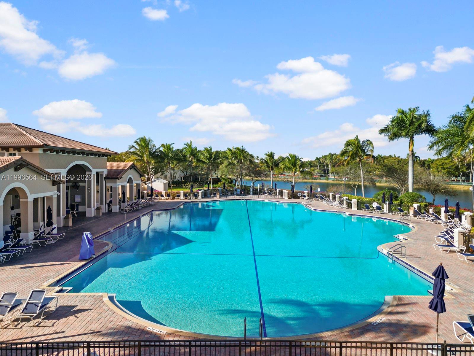 9473 Southwest 227th Terrace Cutler Bay, FL 33190 - Photo 28 of 31 a view of a swimming pool with a garden
