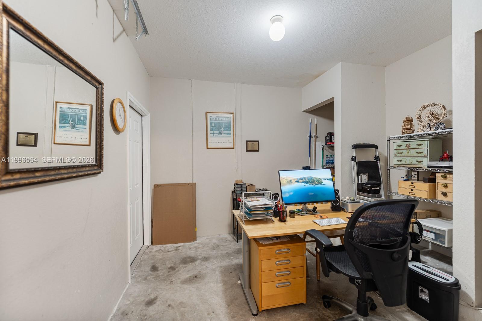 9473 Southwest 227th Terrace Cutler Bay, FL 33190 - Photo 29 of 31 a workspace with furniture and wooden floor