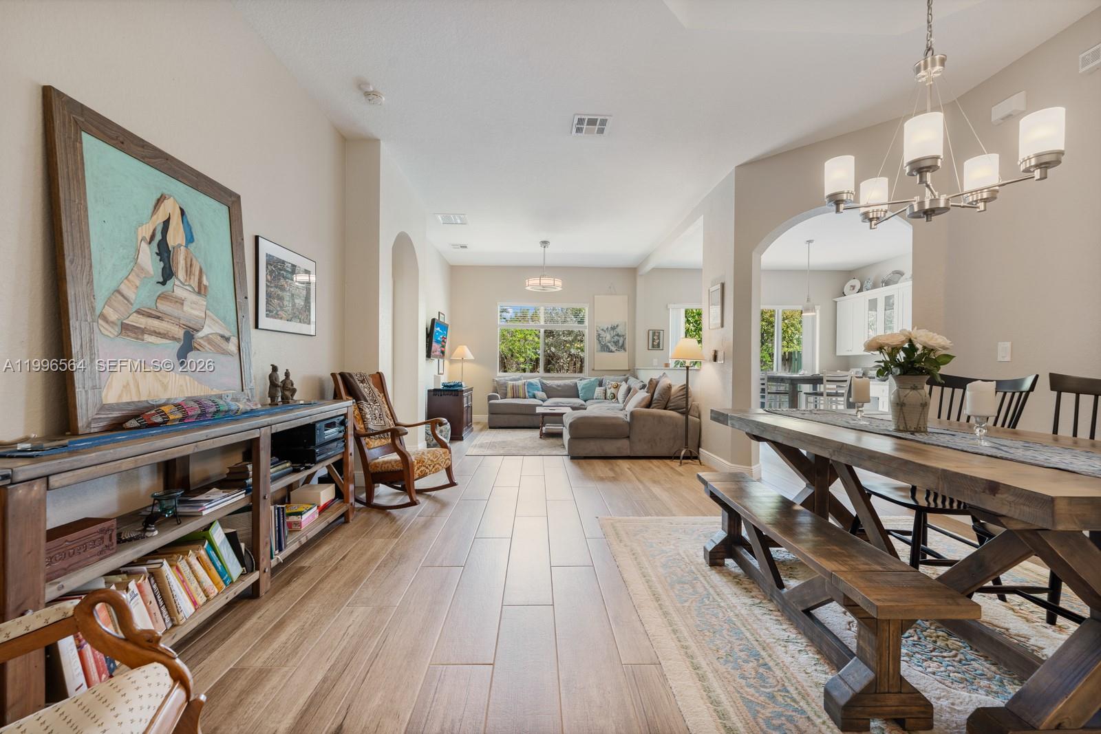 9473 Southwest 227th Terrace Cutler Bay, FL 33190 - Photo 3 of 31 a living room with furniture and a wooden floor