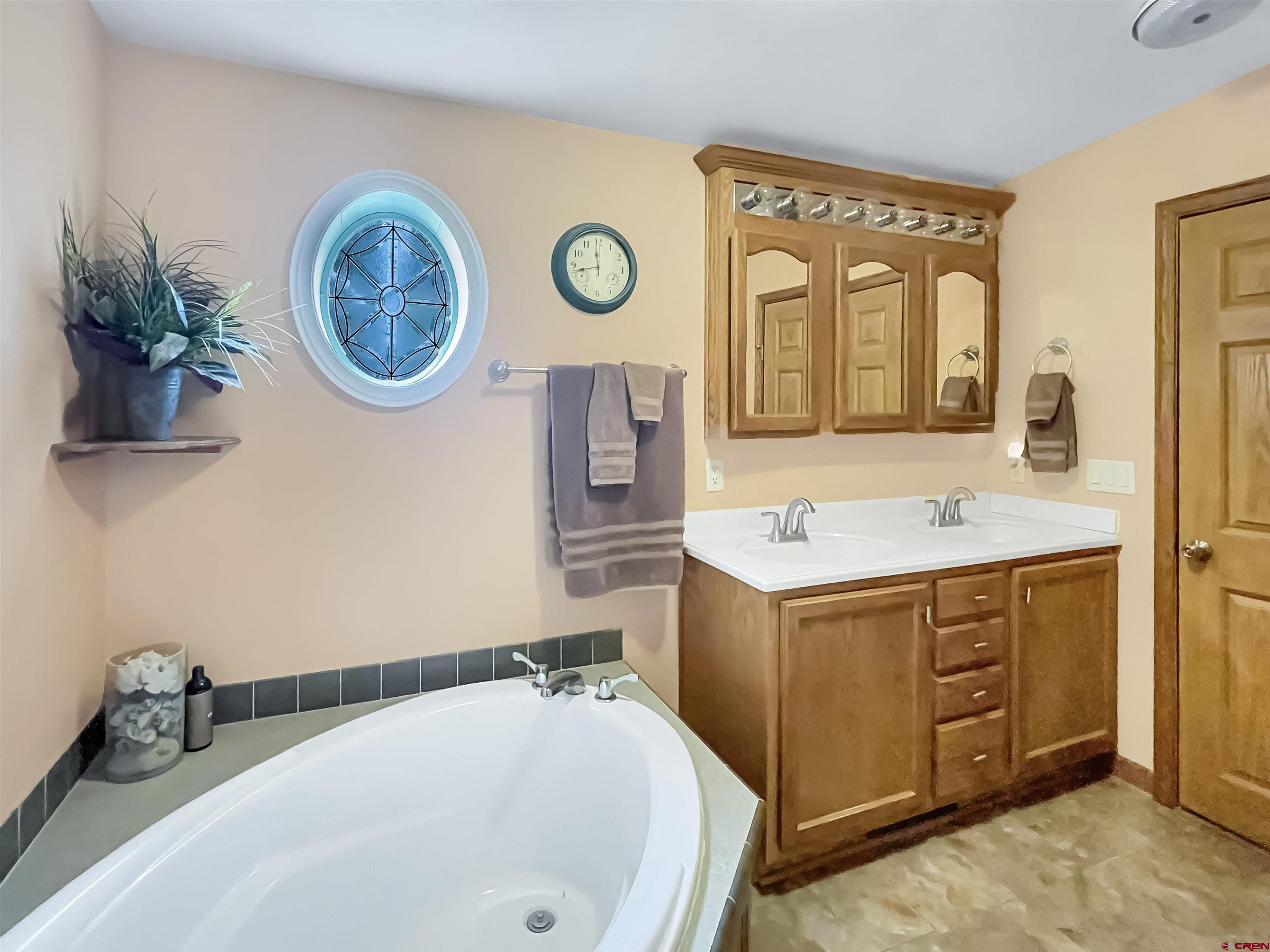 43396 Long Gulch Road Crawford, CO 81415 - Photo 17 of 35 a bathroom with a sink and a mirror