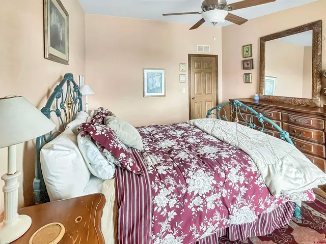 a bathroom with a toilet a sink and a mirror