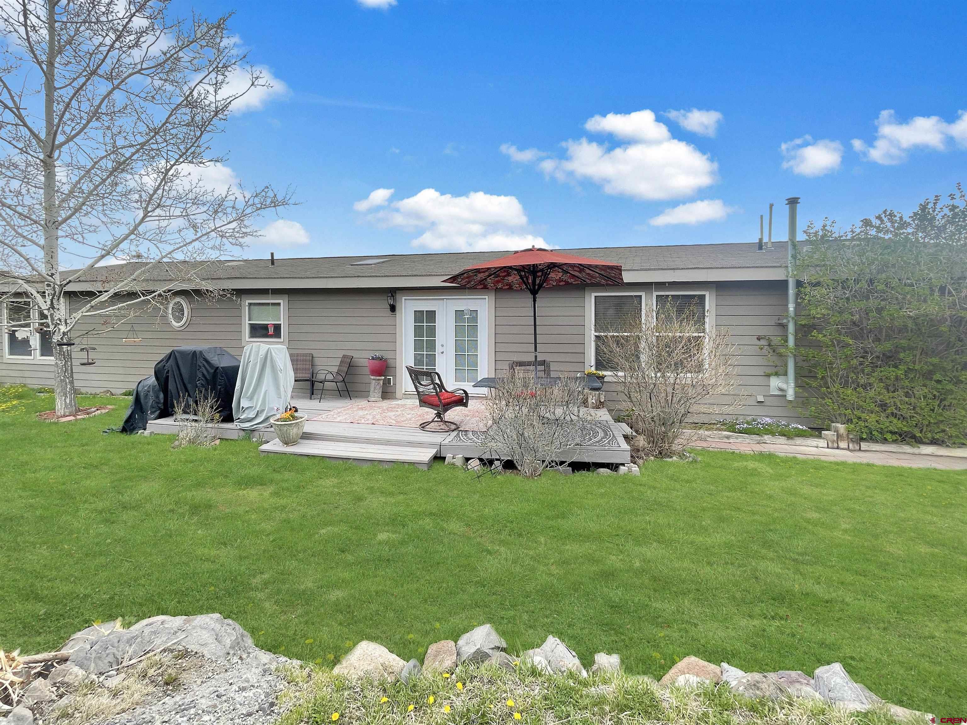 43396 Long Gulch Road Crawford, CO 81415 - Photo 29 of 35 a front view of a house with garden