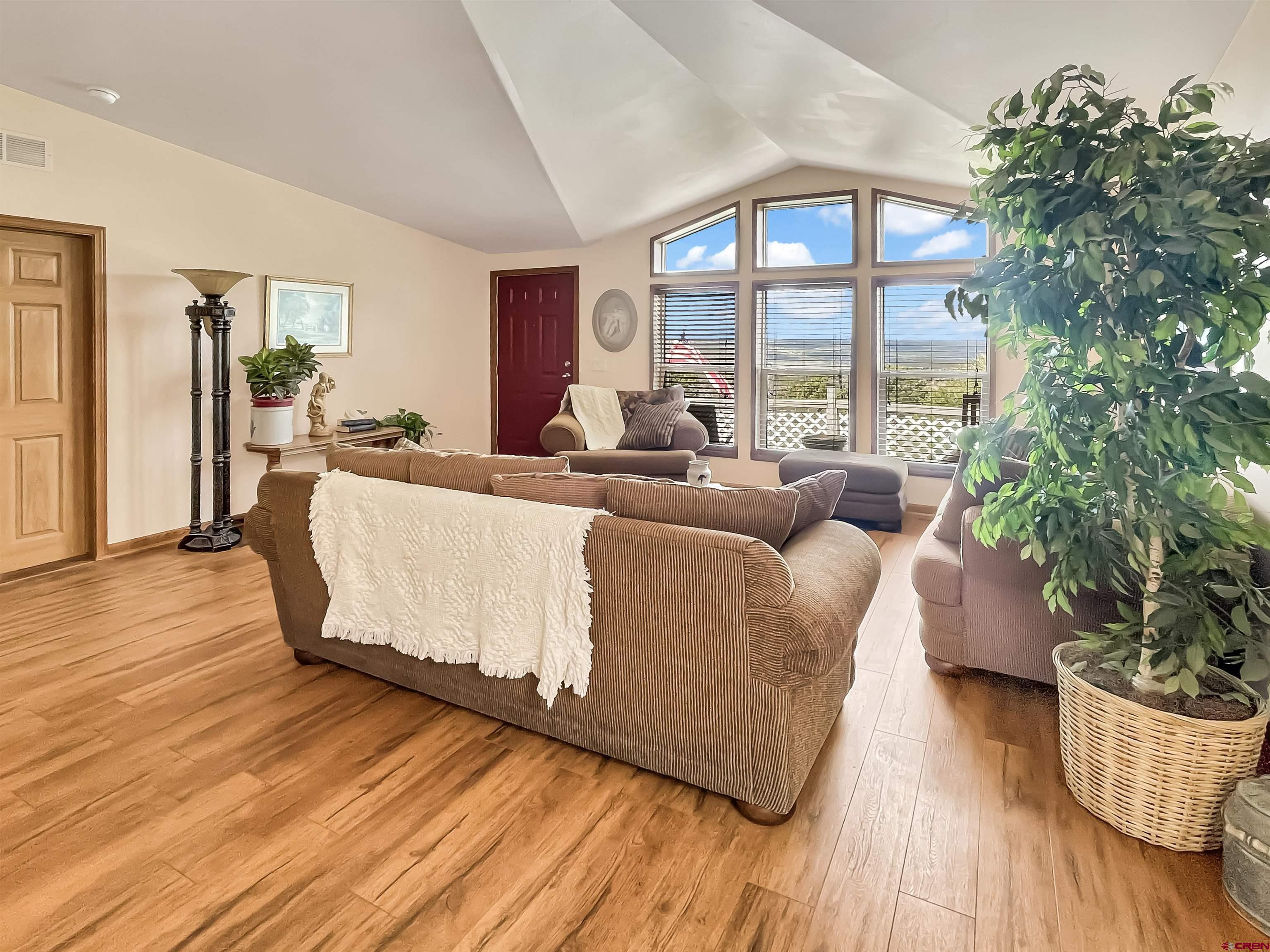 43396 Long Gulch Road Crawford, CO 81415 - Photo 3 of 35 a living room with furniture and a large window