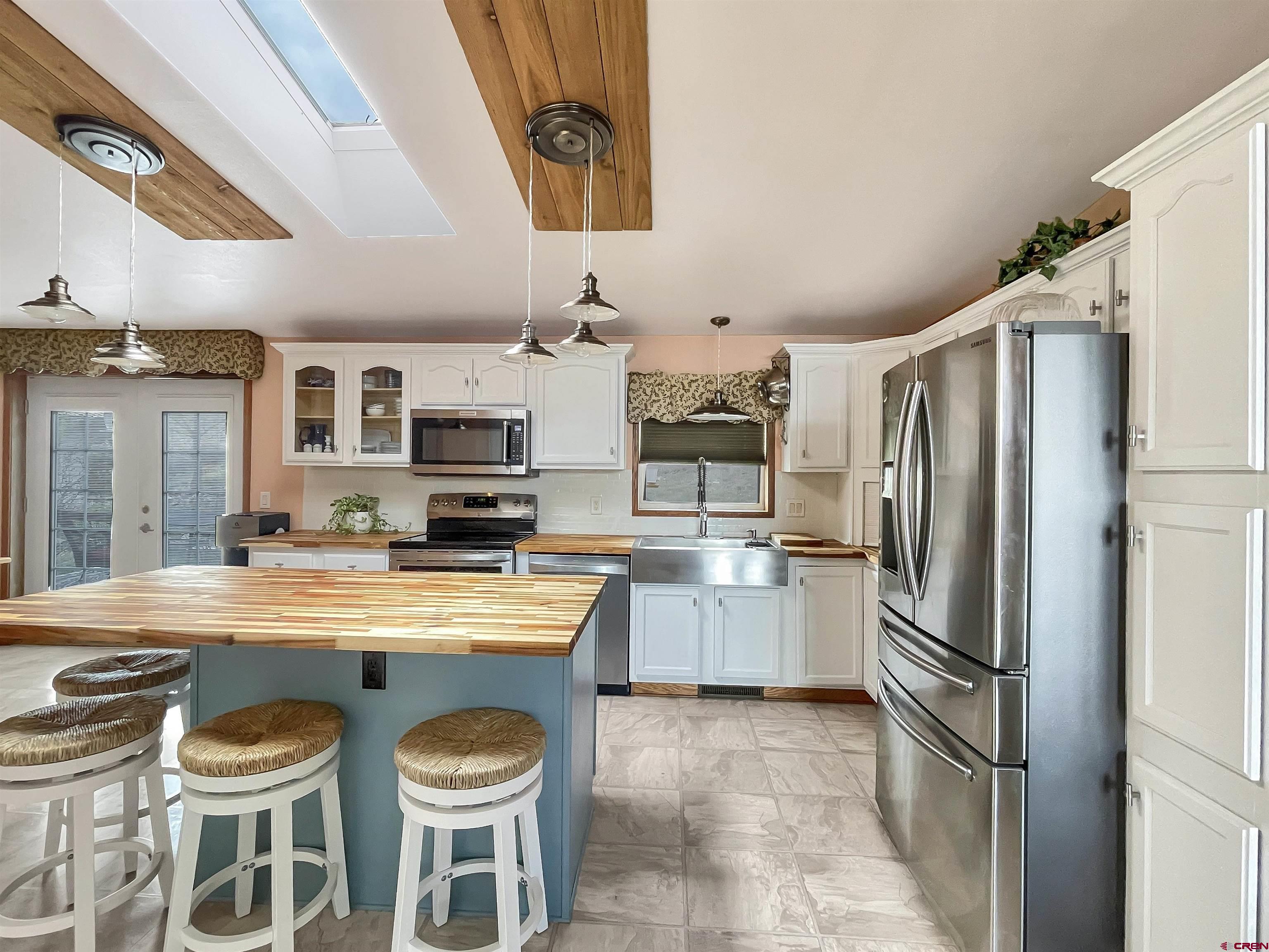 43396 Long Gulch Road Crawford, CO 81415 - Photo 6 of 35 a kitchen with refrigerator and stove