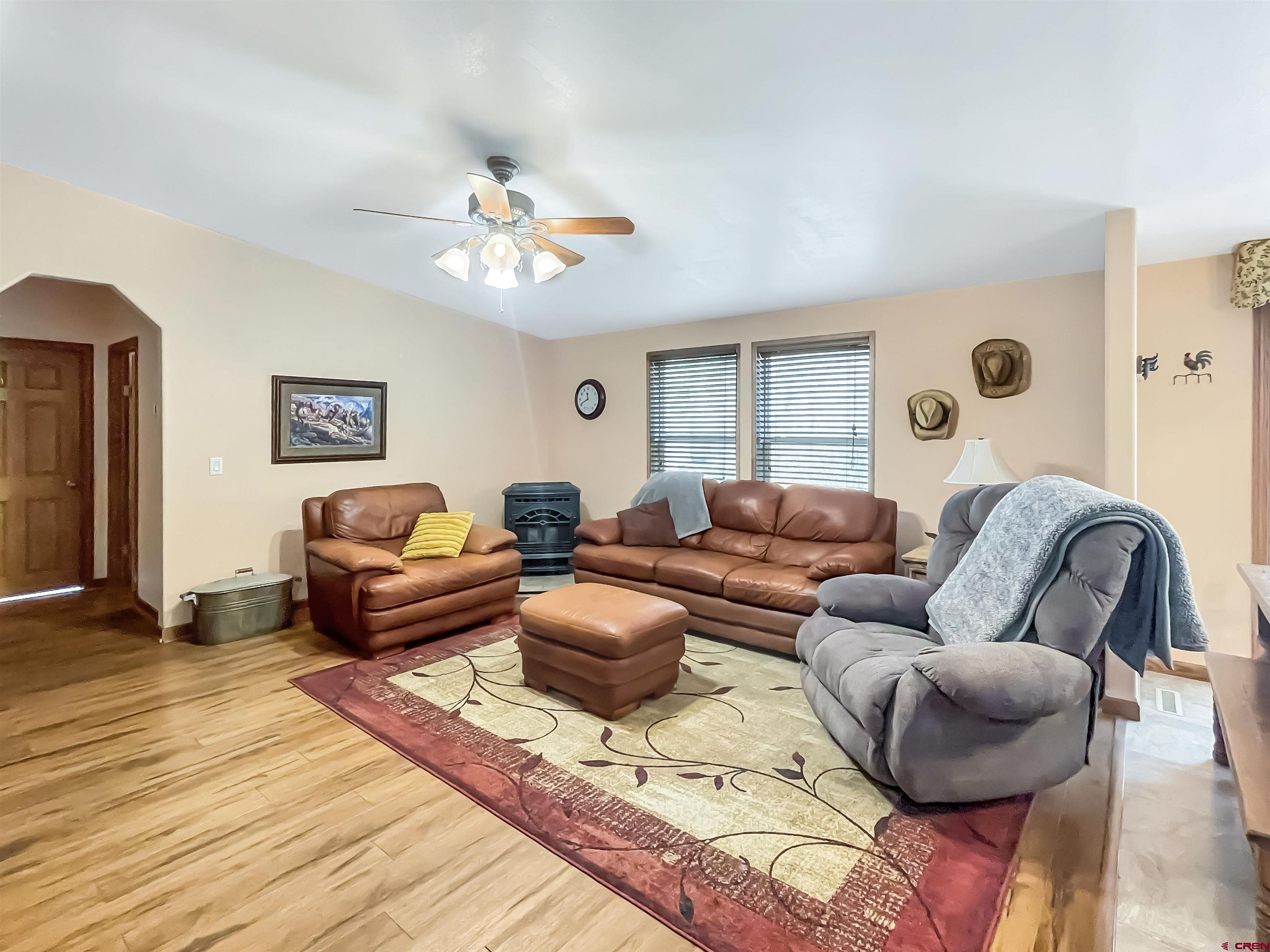 43396 Long Gulch Road Crawford, CO 81415 - Photo 10 of 35 a living room with furniture ceiling fan and a rug