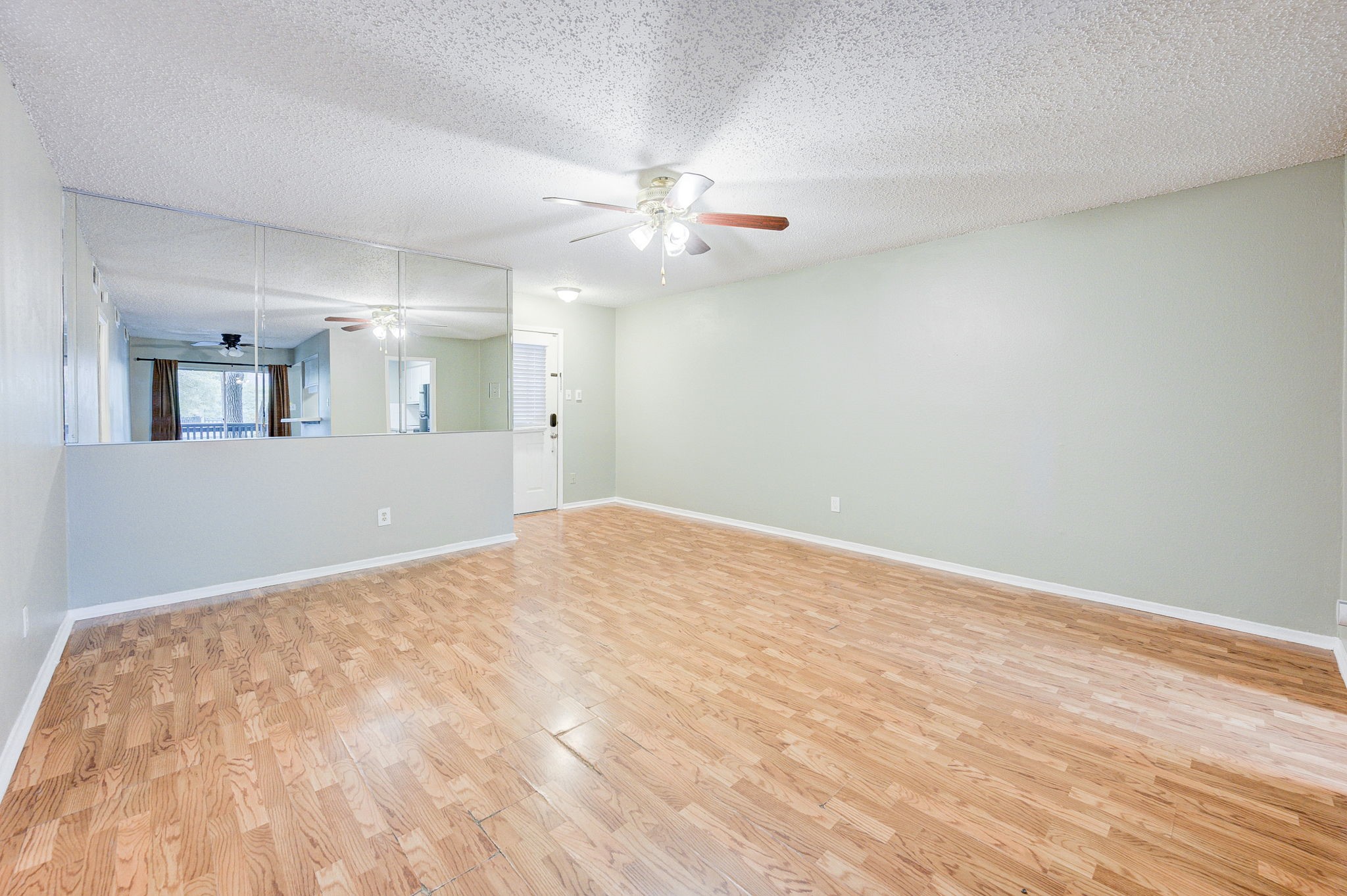 8229 Kingsbrook Road, Unit 229 Houston, TX 77024 - Photo 12 of 50 wooden floor in an empty room