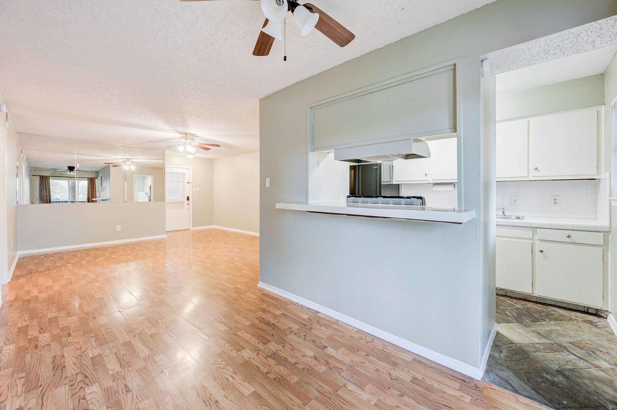 8229 Kingsbrook Road, Unit 229 Houston, TX 77024 - Photo 15 of 50 a view of a kitchen with wooden floor and a sink