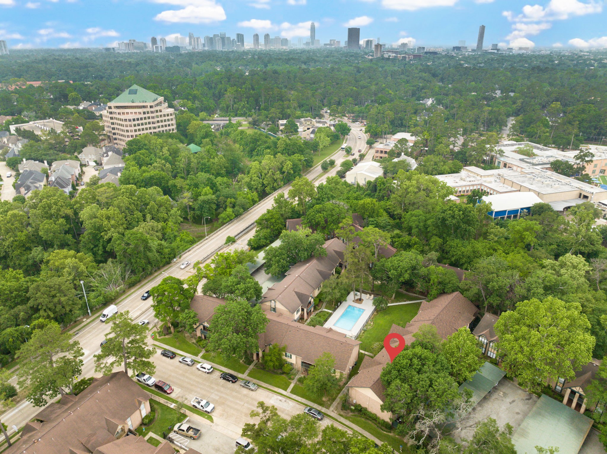 8229 Kingsbrook Road, Unit 229 Houston, TX 77024 - Photo 33 of 50 an aerial view of river residential houses with outdoor space and swimming pool
