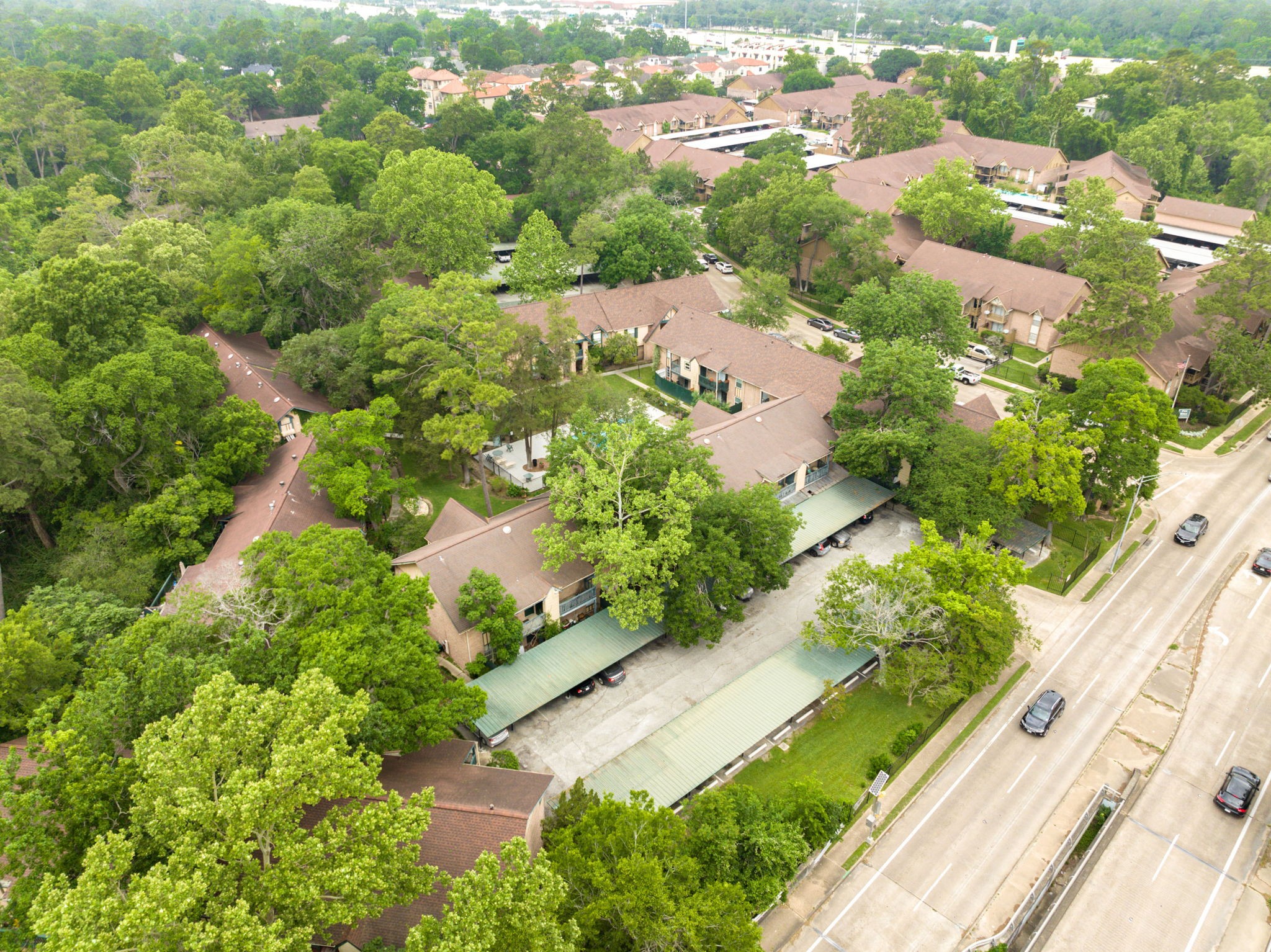 8229 Kingsbrook Road, Unit 229 Houston, TX 77024 - Photo 40 of 50 an aerial view of residential houses with outdoor space