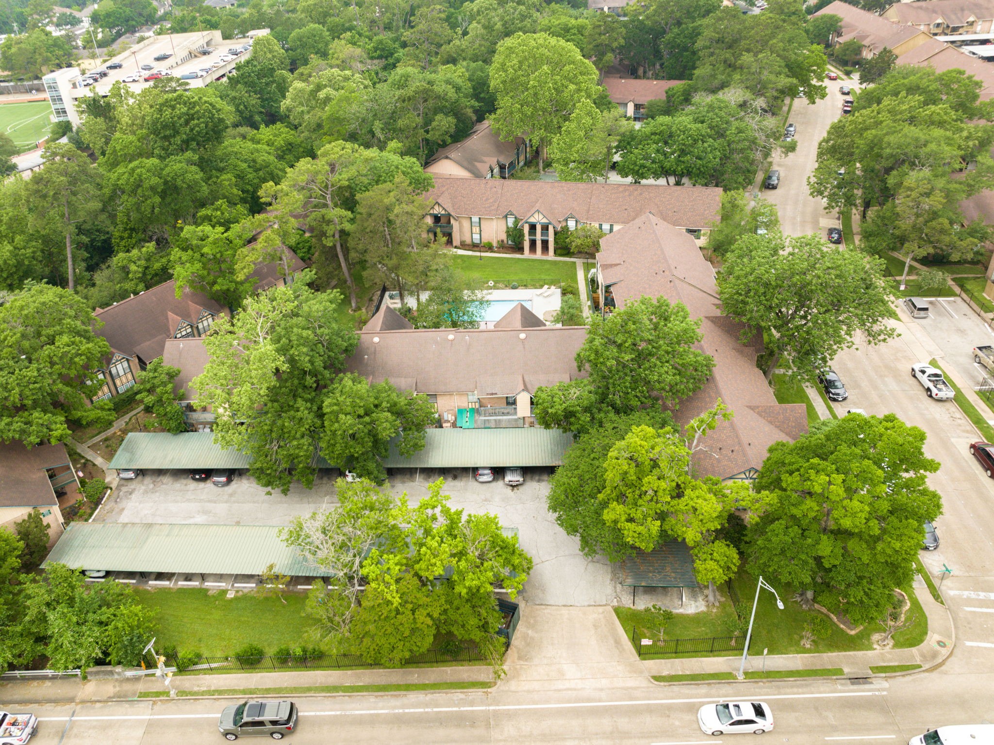 8229 Kingsbrook Road, Unit 229 Houston, TX 77024 - Photo 42 of 50 an aerial view of a house with garden space and street view
