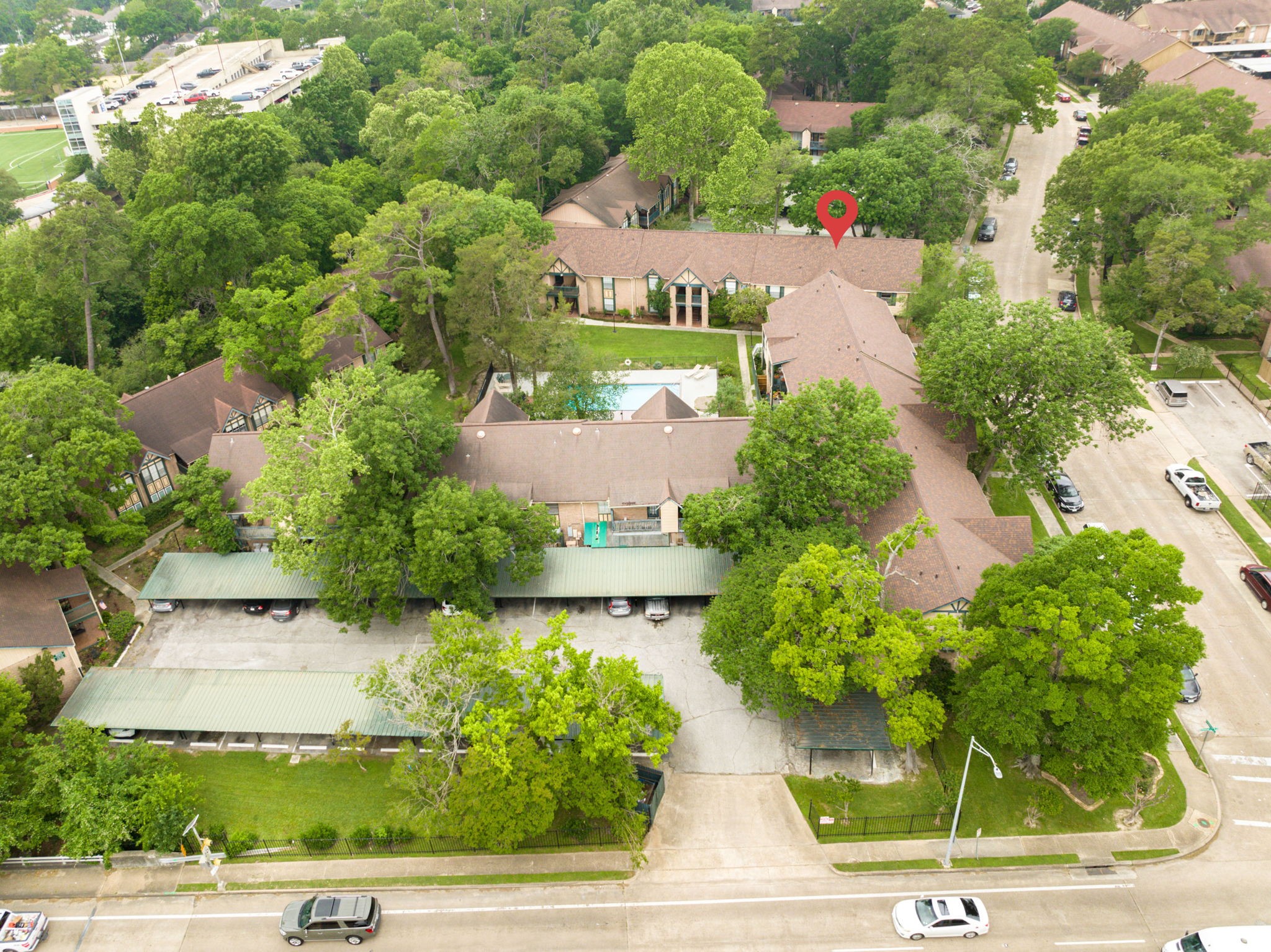 8229 Kingsbrook Road, Unit 229 Houston, TX 77024 - Photo 43 of 50 an aerial view of a house with garden space and street view