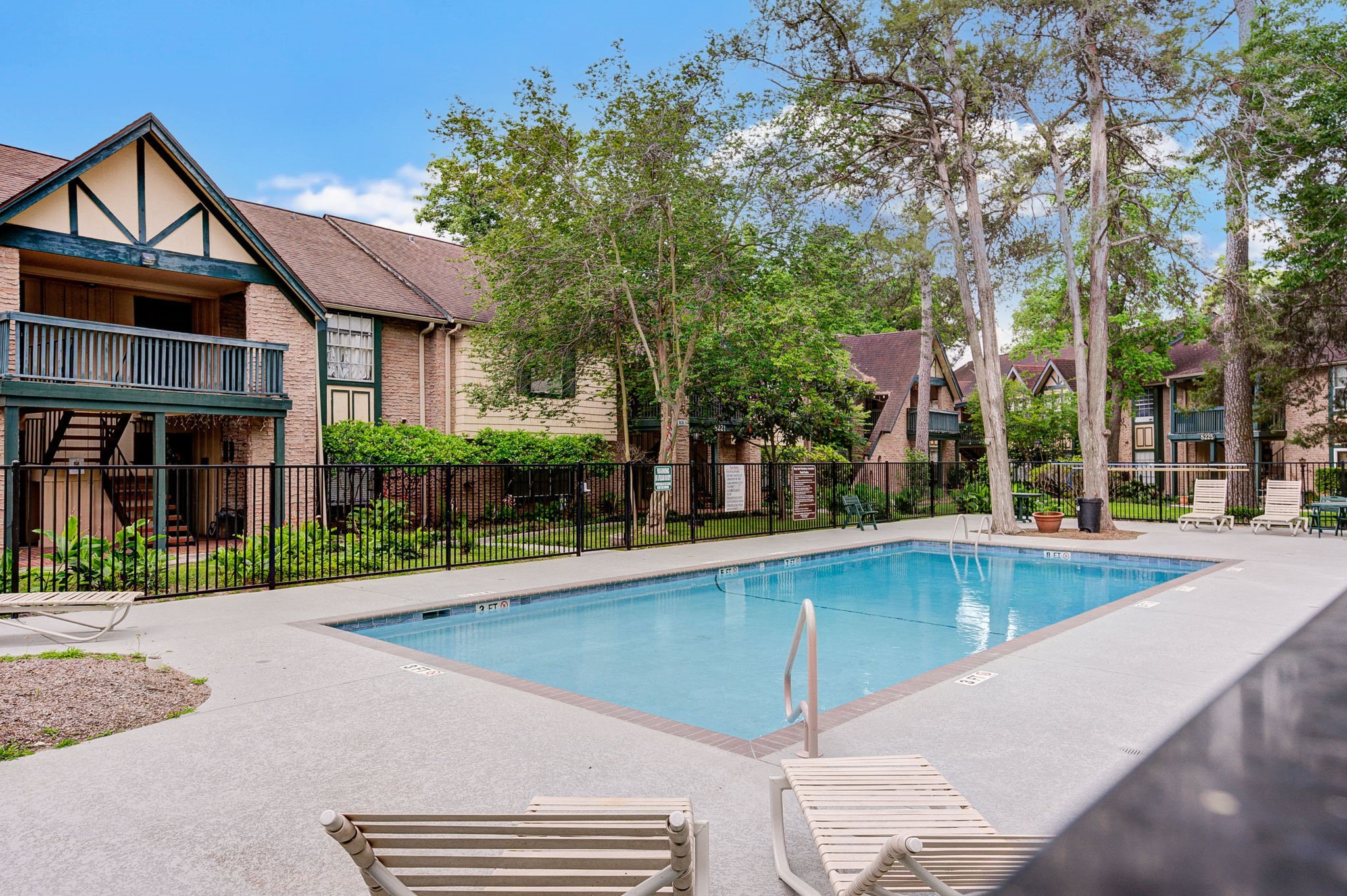 8229 Kingsbrook Road, Unit 229 Houston, TX 77024 - Photo 46 of 50 a view of a house with a swimming pool