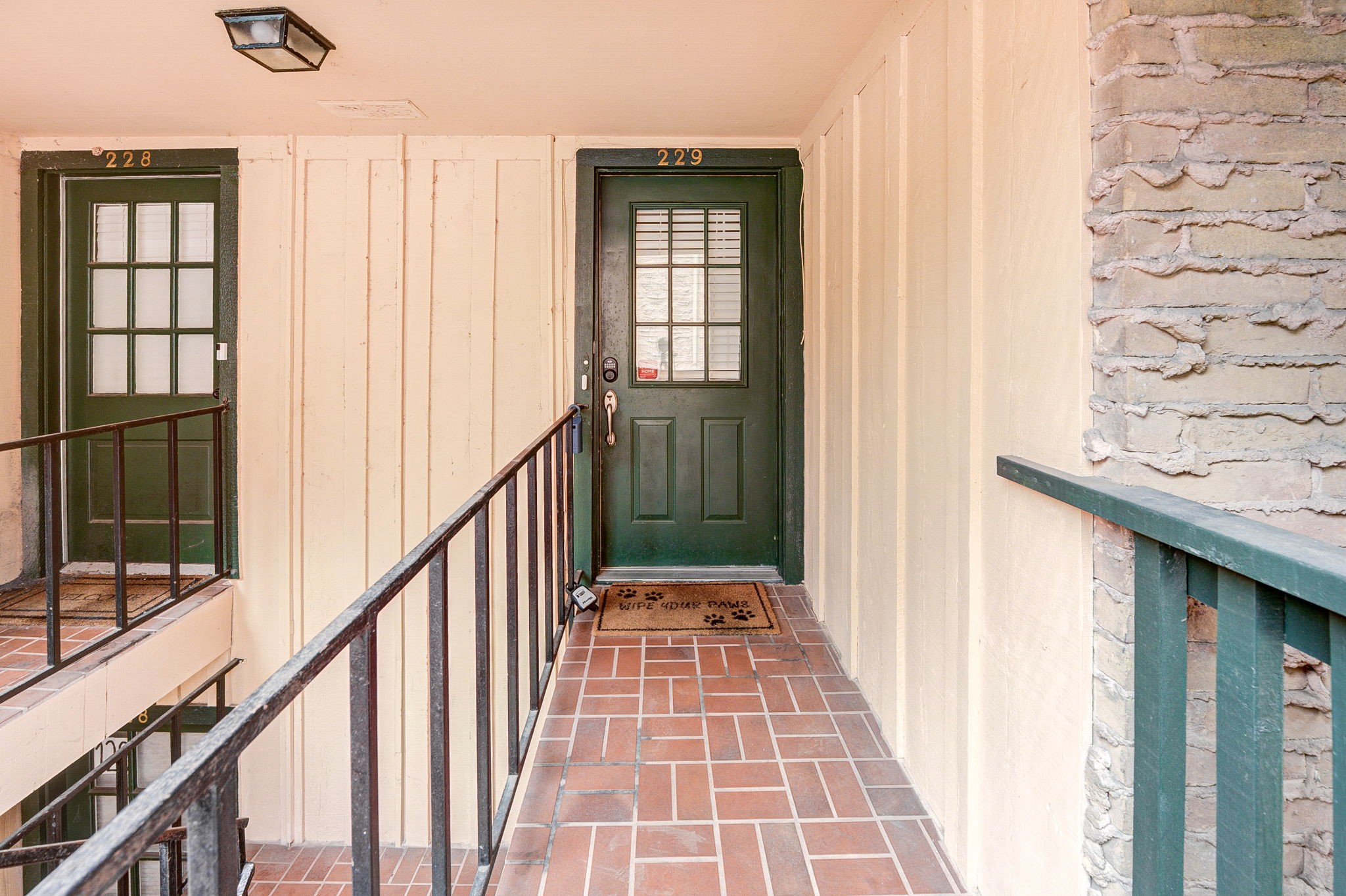 8229 Kingsbrook Road, Unit 229 Houston, TX 77024 - Photo 8 of 50 a view of a hallway with wooden floor and staircase