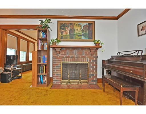 196 Chiswick Road Boston, MA 02135 - Photo 12 of 23 a living room with a fireplace furniture and a large window