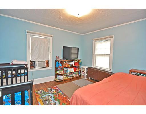 196 Chiswick Road Boston, MA 02135 - Photo 16 of 23 a bedroom with furniture and a flat screen tv