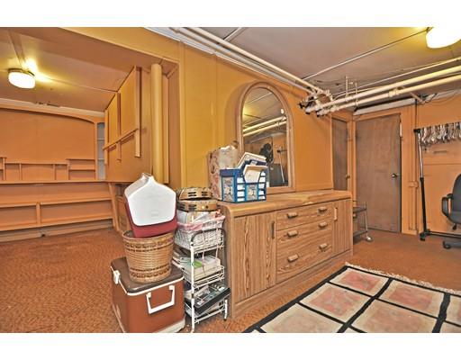 196 Chiswick Road Boston, MA 02135 - Photo 19 of 23 a room with wooden cabinets and stainless steel appliances