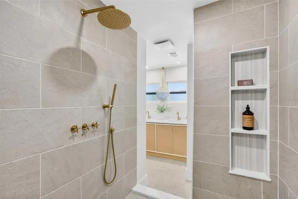 a bathroom with a bathtub and shower