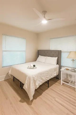 a bedroom with a bed and a table