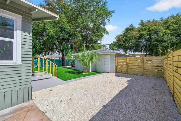 a view of a backyard with a small cabin