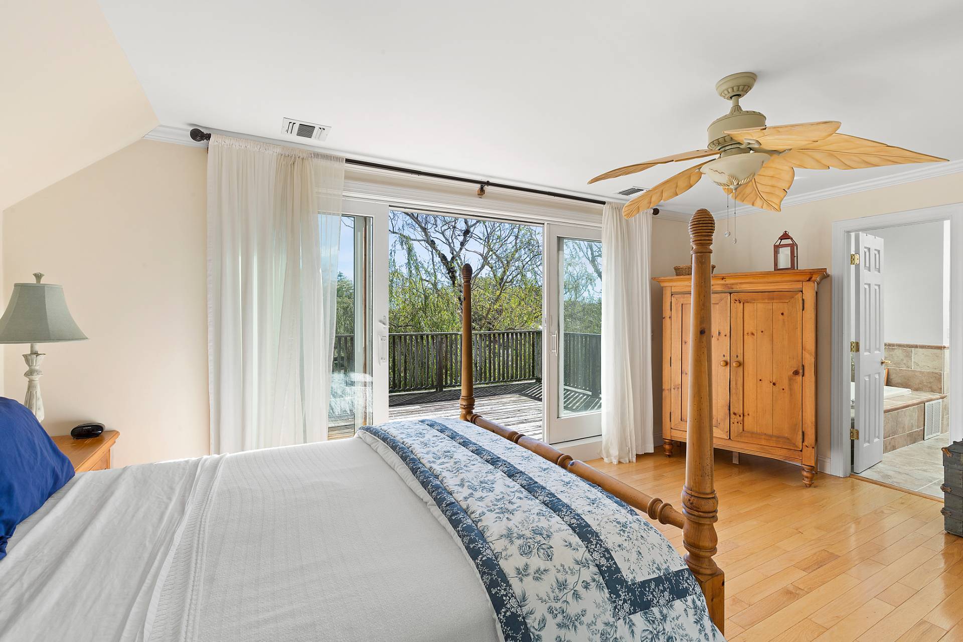 23 Whiting Road East Quogue, NY 11942 - Photo 6 of 21 a bedroom with a bed dresser and a large window