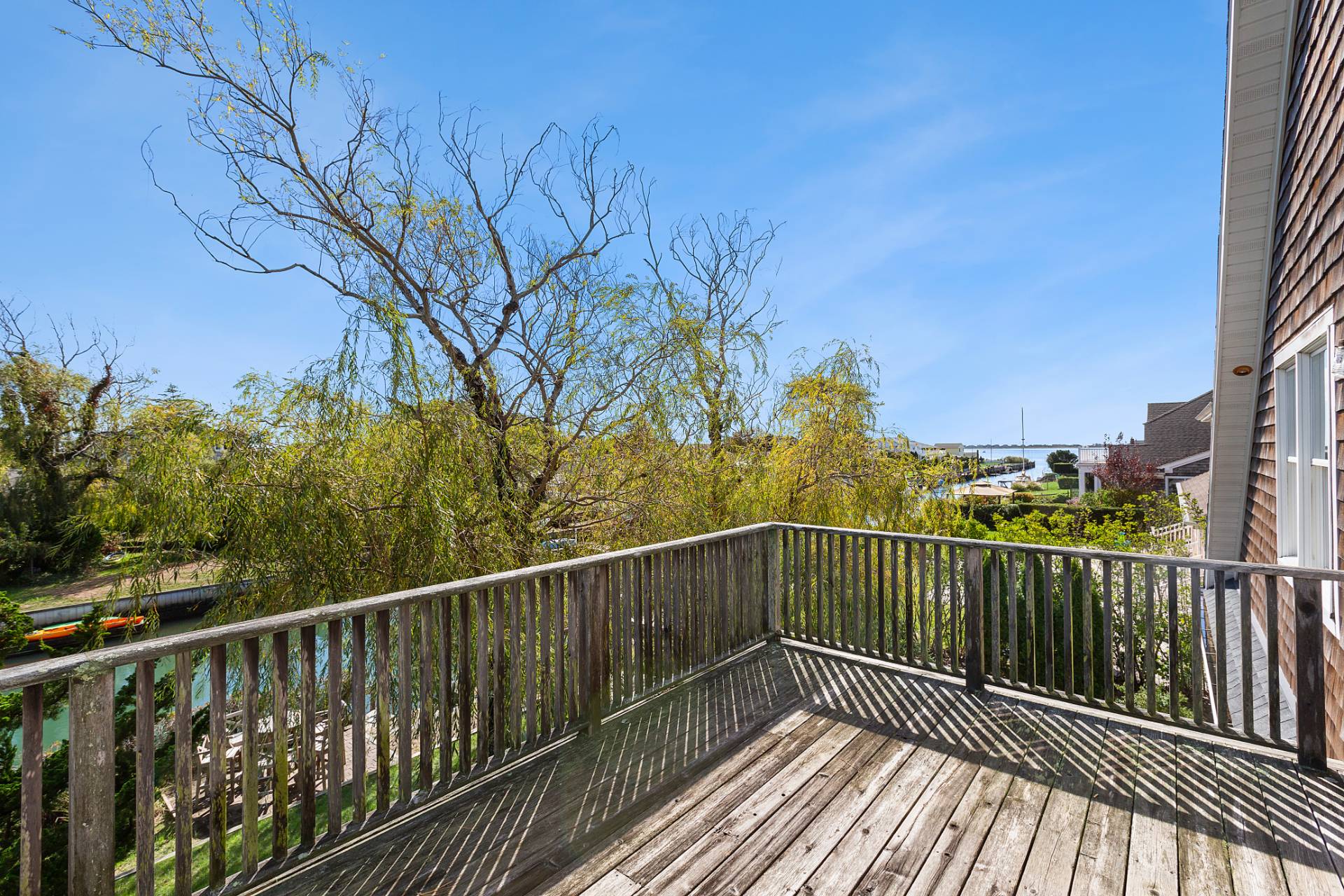 23 Whiting Road East Quogue, NY 11942 - Photo 8 of 21 a view of a balcony with wooden floor