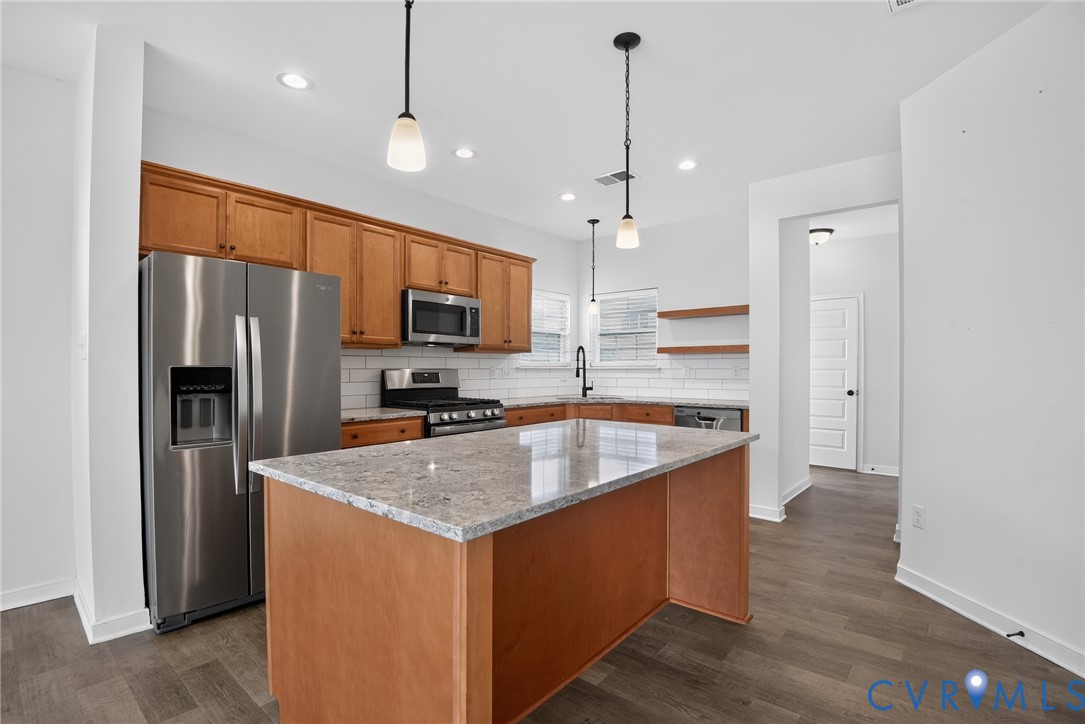7825 Old Guild Road Richmond, VA 23237 - Photo 10 of 35 Spacious kitchen featuring a large island with a s
