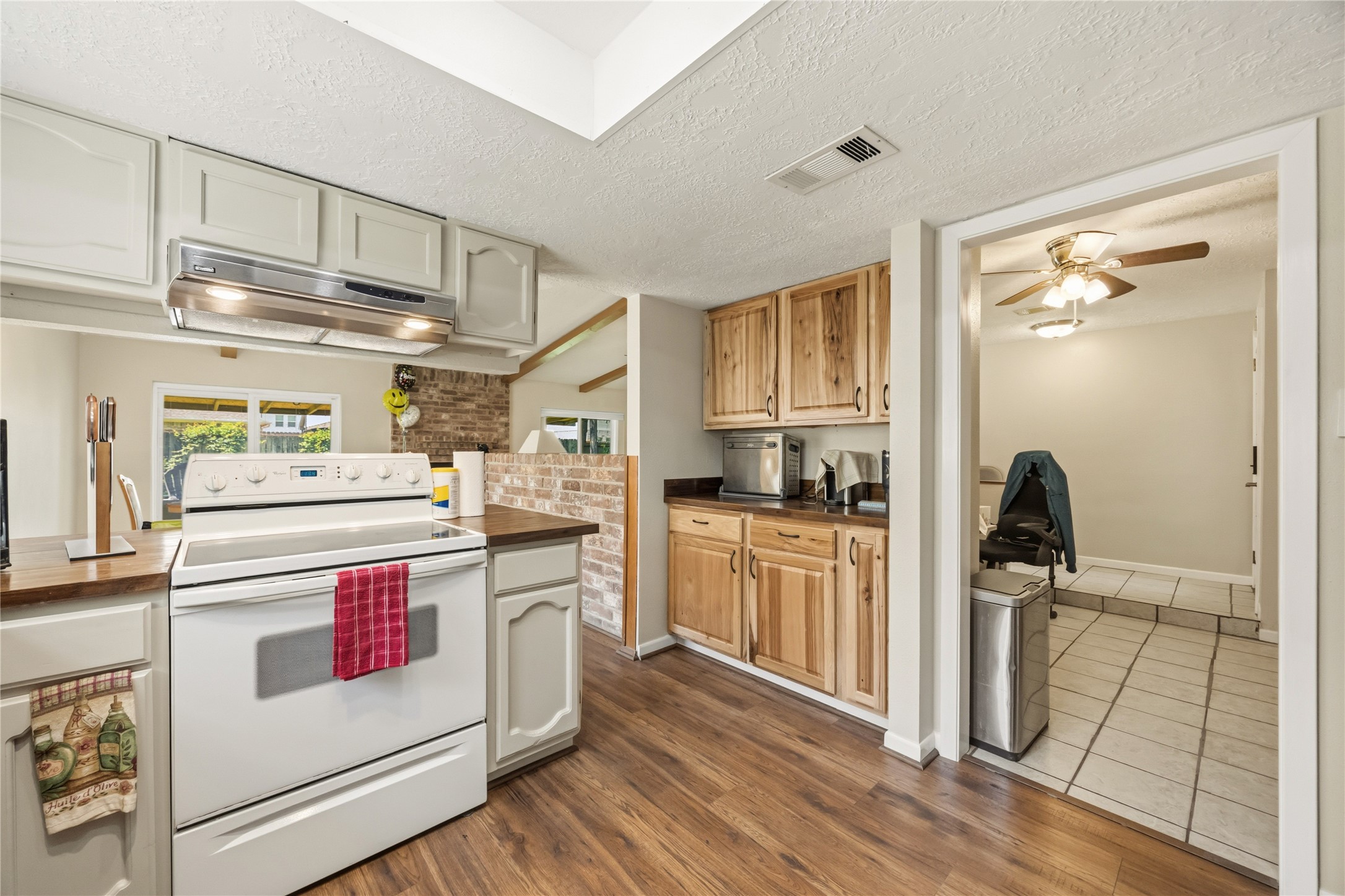 9635 Birsay Street Spring, TX 77379 - Photo 9 of 24 a kitchen with a stove and a refrigerator
