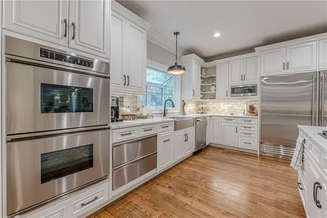 a view of work space with furniture and window