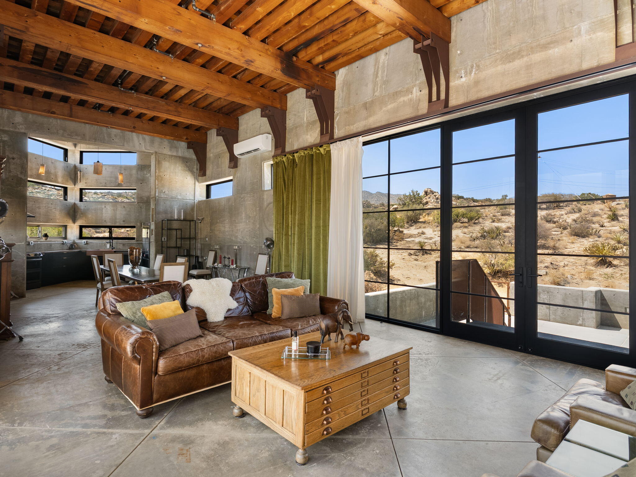 60240 Juniper Road Mountain Center, CA 92561 - Photo 13 of 37 a living room with furniture and a large window
