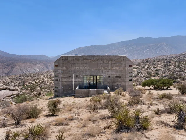 a view of a large building in the middle of a yard