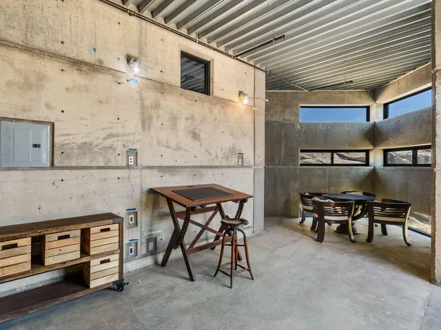 a dining room with a table and chairs