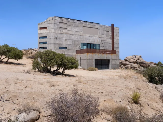 a large building with a large tree in front of it