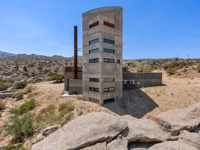 a view of roof with wooden wall and roof
