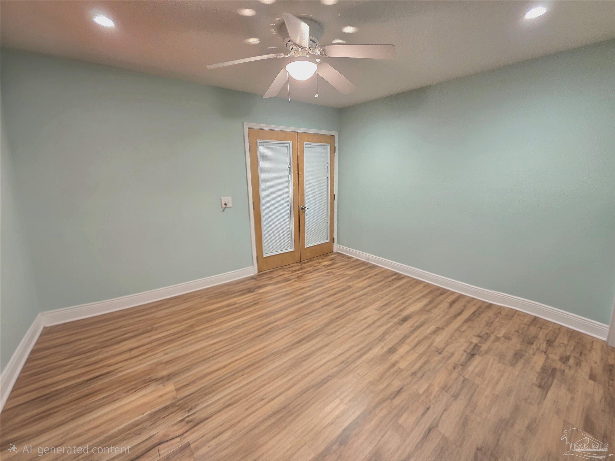 1908 Joshua Drive Cantonment, FL 32533 - Photo 21 of 47 a view of empty room with wooden floor and fan