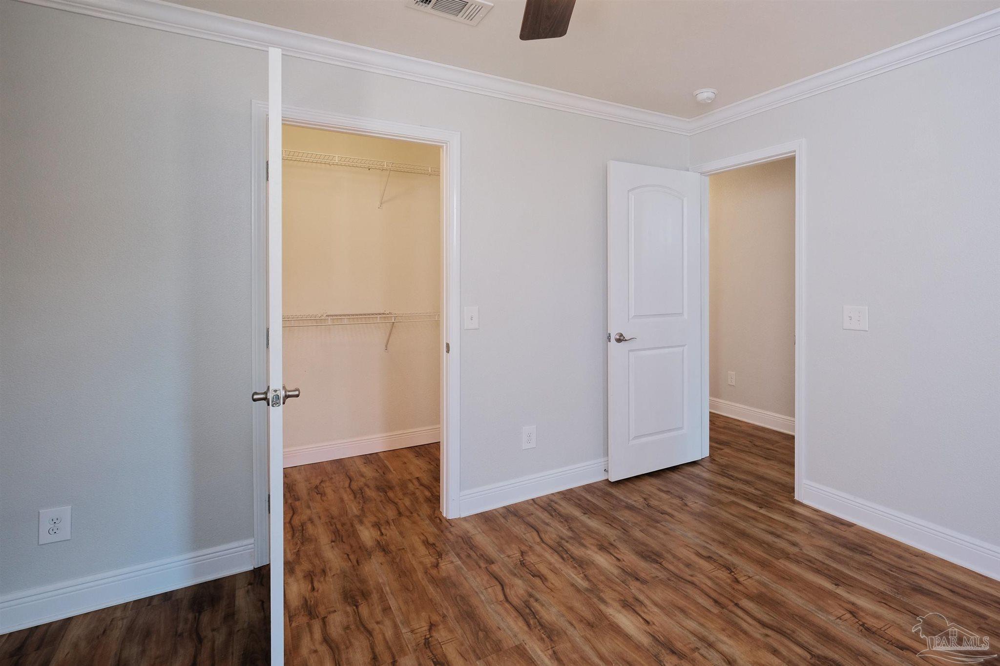 1908 Joshua Drive Cantonment, FL 32533 - Photo 33 of 47 an empty room with wooden floor and closet