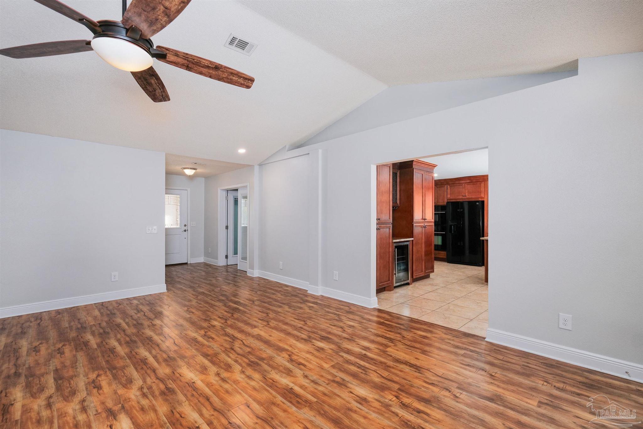 1908 Joshua Drive Cantonment, FL 32533 - Photo 9 of 47 a view of an empty room with wooden floor