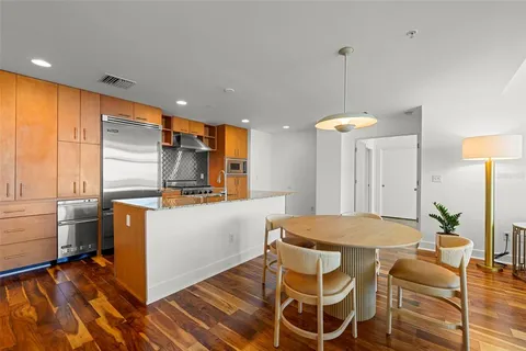 a kitchen with a table and chairs