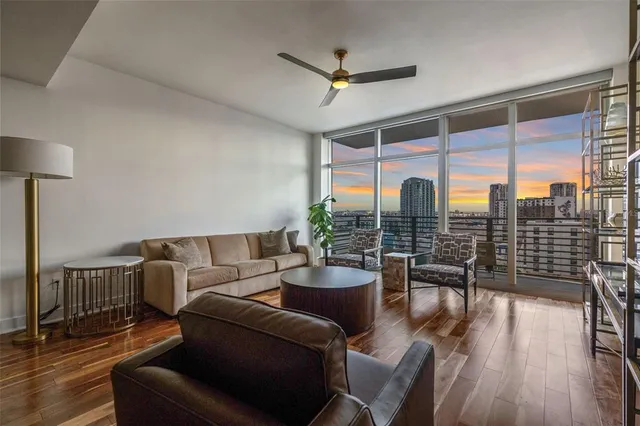 a living room with furniture and a large window