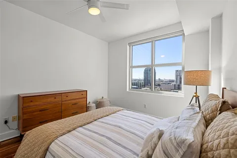 a bedroom with a bed and window