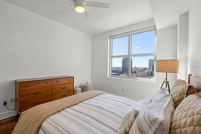 a bedroom with a bed and window