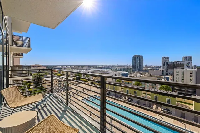 a view of a balcony with city view