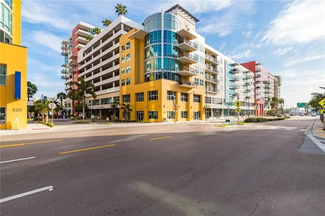 a view of a street with a building in the background