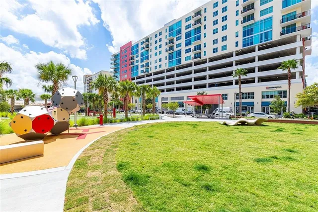 a view of swimming pool with a yard and a fountain